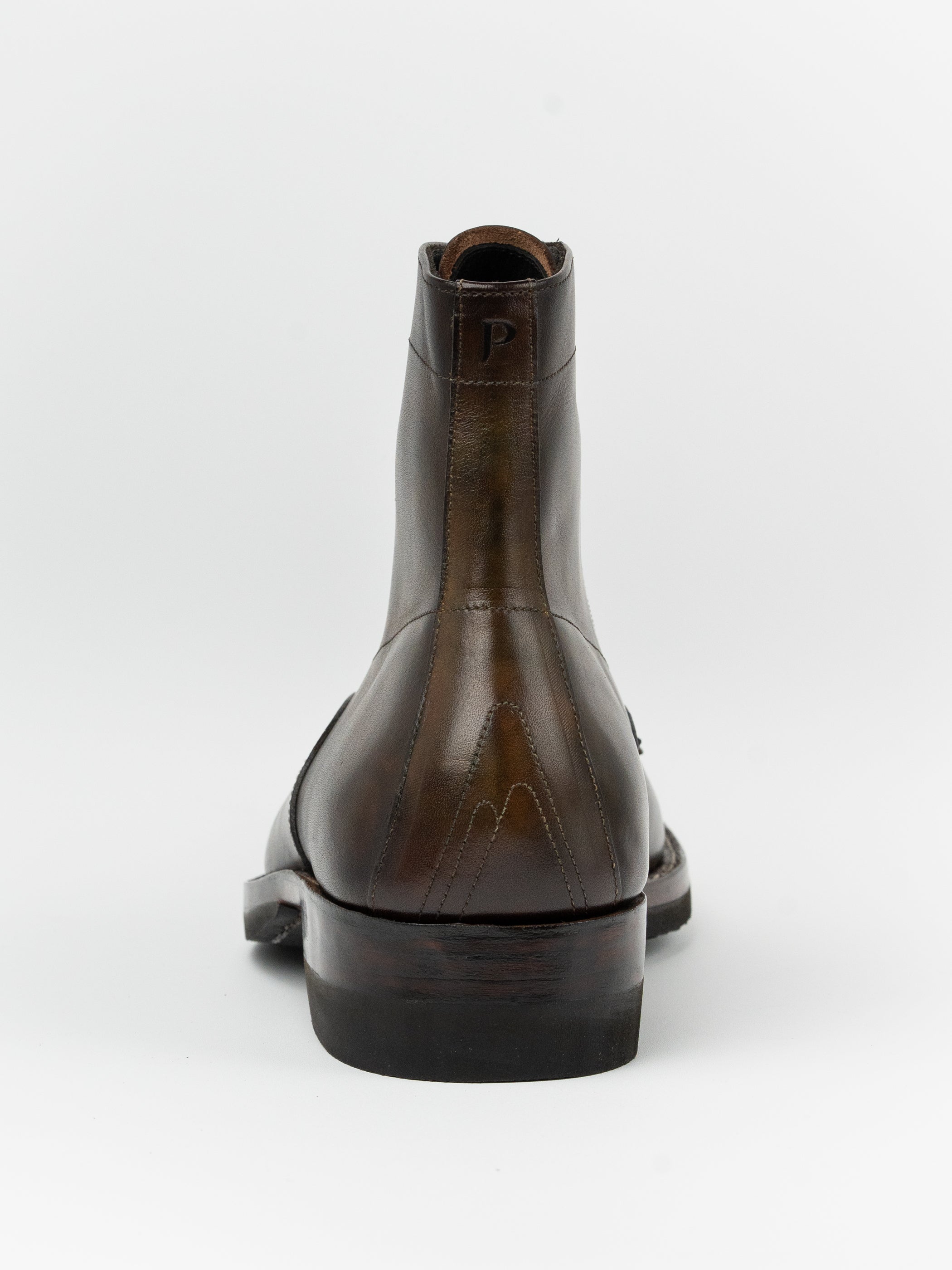 Brown leather boot on a white background