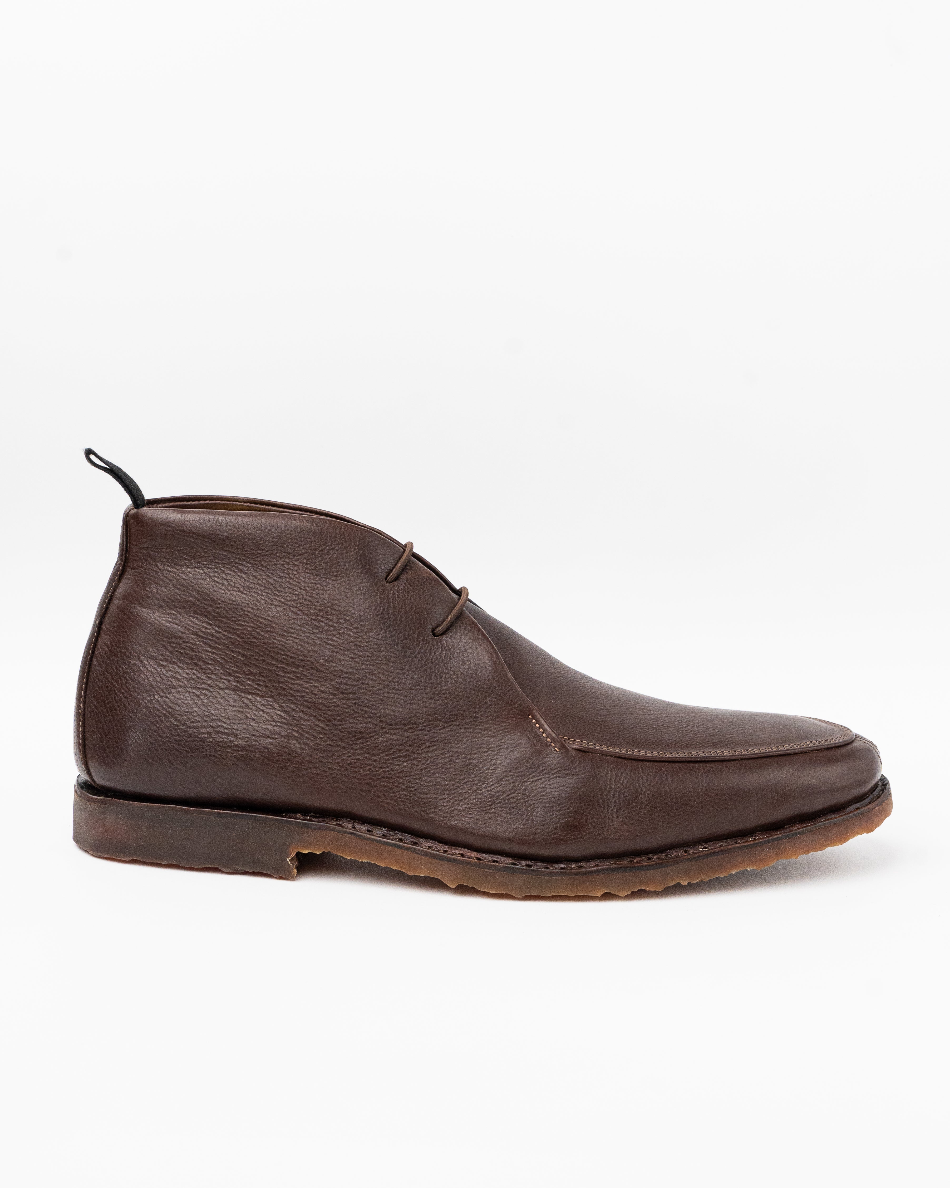 Brown leather shoe on a white background